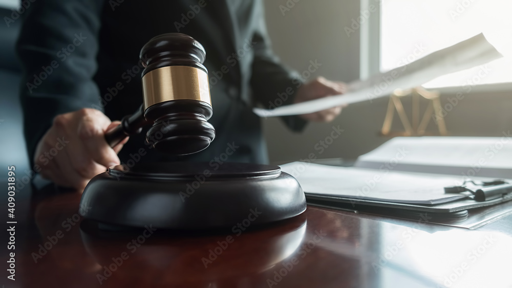 udge gavel with Justice lawyers having team meeting at law firm background. Concepts of Law and Legal services. udge gavel with Justice lawyers having team meeting at law firm background. Concepts of Law and Legal services.