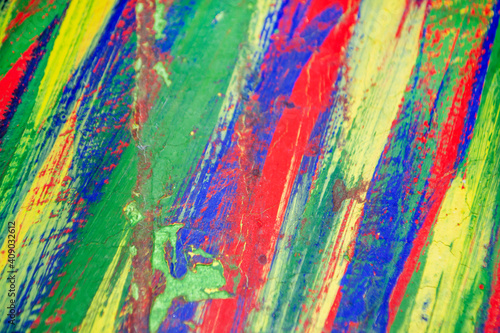 Background from different strokes of red, yellow, green and blue paint