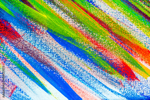 Background from different strokes of red, yellow, green and blue paint