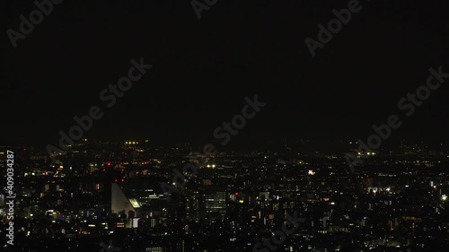 Wallpaper Mural TOKYO, JAPAN : Aerial high angle sunset CITYSCAPE of TOKYO and MOUNT FUJI. Huge sun sinking  behind mountains. Japanese city life and nature concept. Long time lapse tracking shot dusk to night. Torontodigital.ca