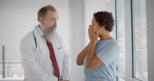 African woman starts crying after hearing bad news about relative death in hospital