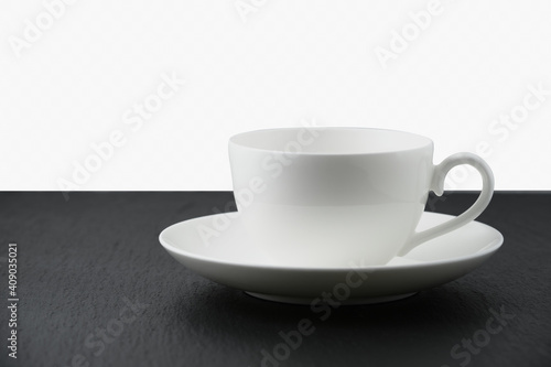 White empty cup on black table