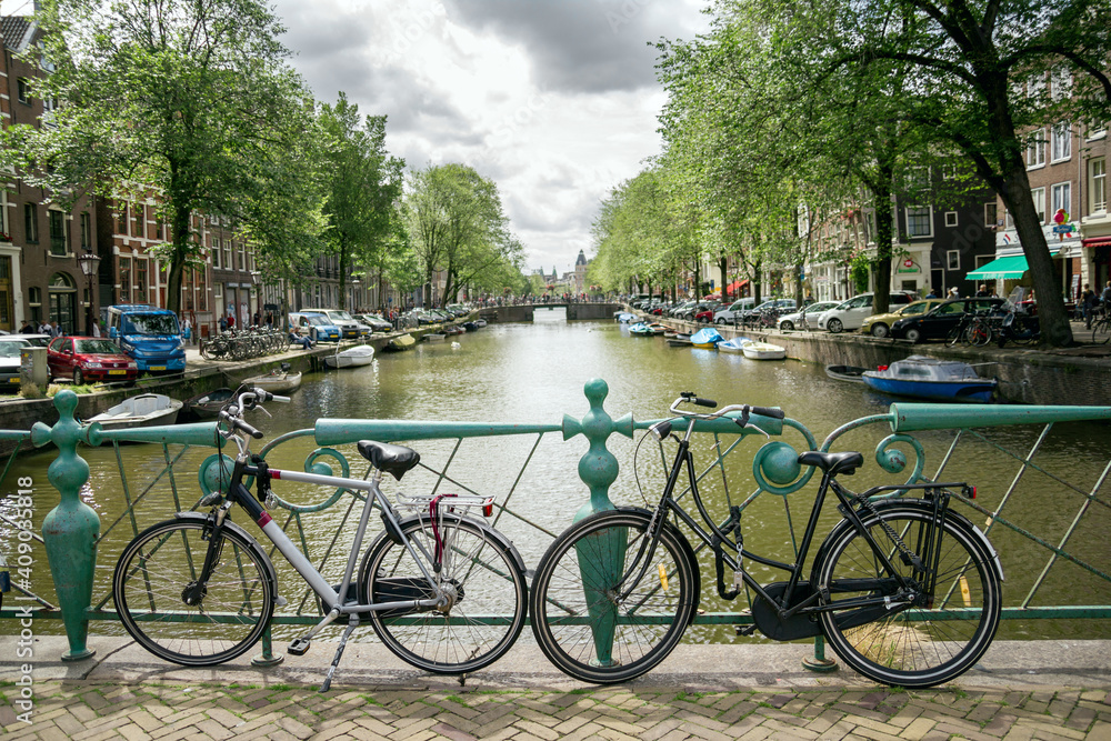 Amsterdam, canals and bikes. City travel concept.