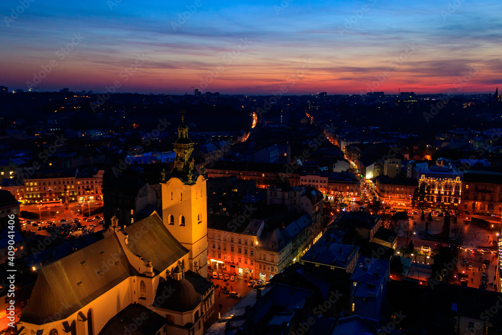 Aerial night view of illuminated Latin cathedral and Rynok square in Lviv, Ukraine. View from Lviv town hall