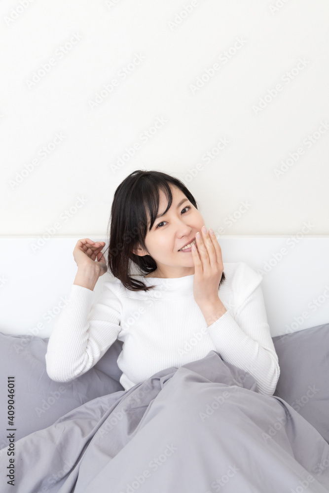 Woman waking up in bed Woman waking up in bed