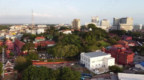 MALACCA, MALAYSIA - DECEMBER 29, 2019: Malacca aerial view at sunset. Sky colors over Melaka city skyscrapers photo