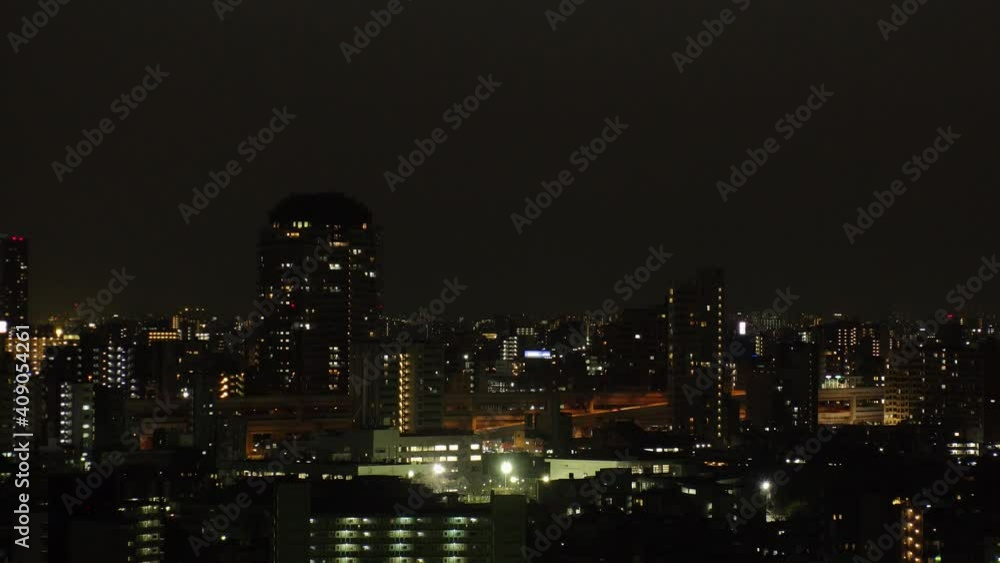 TOKYO, JAPAN : Aerial high angle sunrise CITYSCAPE of TOKYO and MOUNT FUJI. View of houses at residential area. Japanese city life and nature concept. Long time lapse zoom in shot night to morning. TOKYO, JAPAN : Aerial high angle sunrise CITYSCAPE of TOKYO and MOUNT FUJI. View of houses at residential area. Japanese city life and nature concept. Long time lapse zoom in shot night to morning.