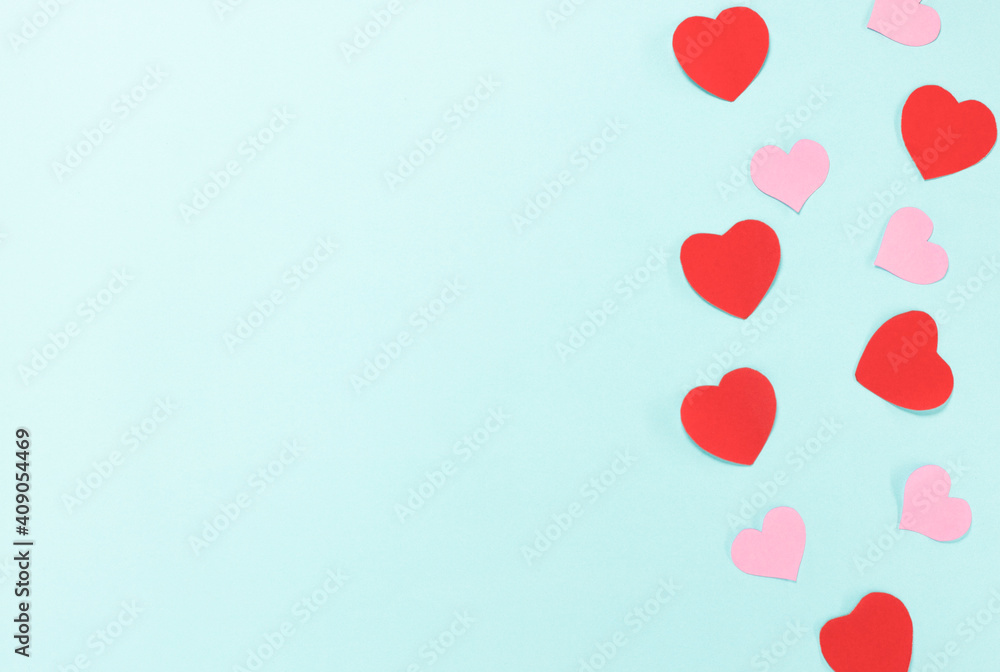 Red and pink heart switch on blue background. Valentine's Day Concept.
