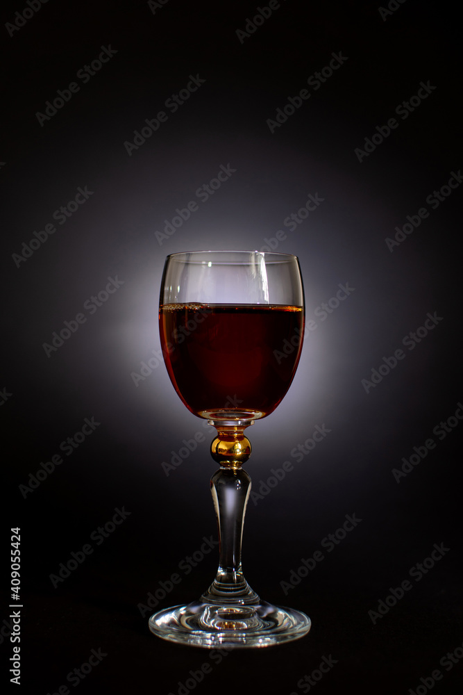 alcoholic drink in a glass on a black background alcoholic drink in a glass on a black background