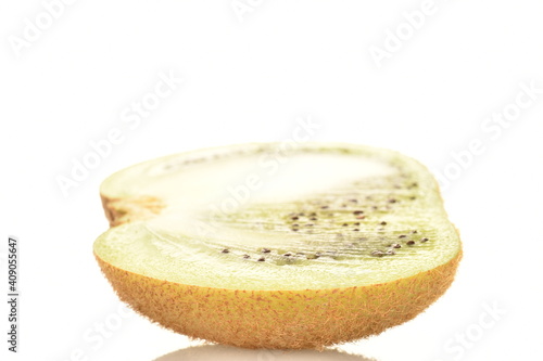 One half of a natural organic kiwi, close up, isolated on white.