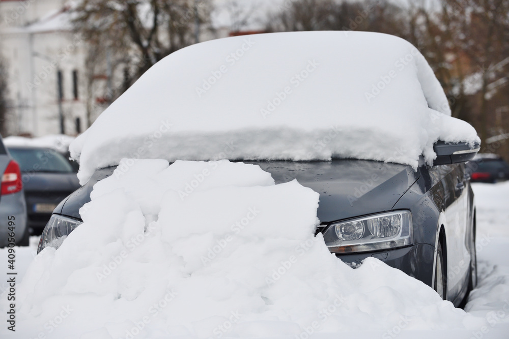 Car covered by snow after a snow blizzard Car covered by snow after a snow blizzard
