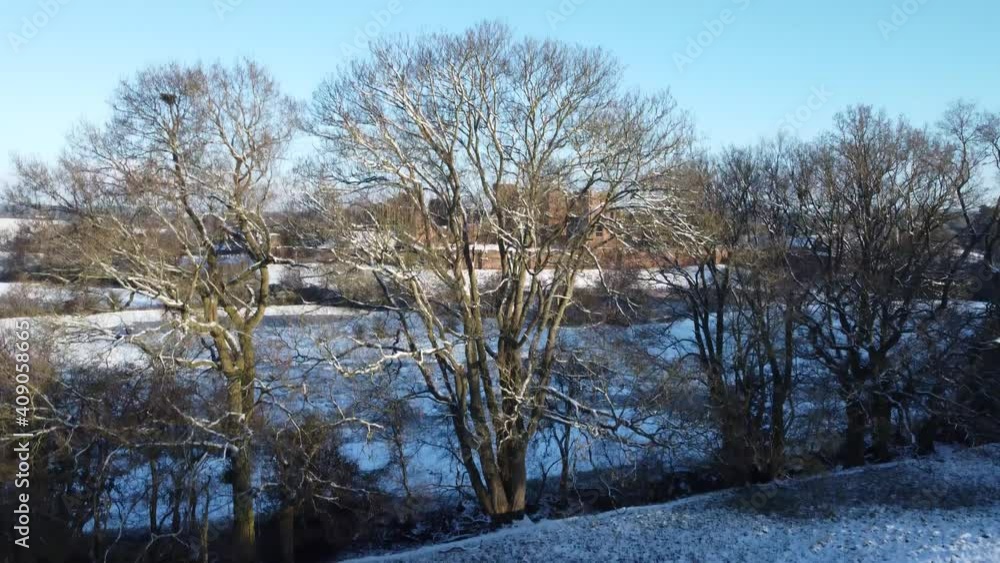 Aerial Kenilworth Castle In Snow Seen Through Winter Trees Aerial Kenilworth Castle In Snow Seen Through Winter Trees
