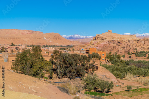 Beautiful Panoramic view of clay houses and the Kasbah  fortress  in the ancient town of Aid Benhaddou  Morocco with Atlas mountains in the background