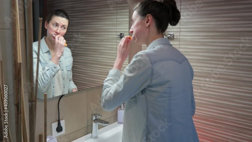 Wallpaper Mural Woman brushes her teeth at home in the bathroom Torontodigital.ca