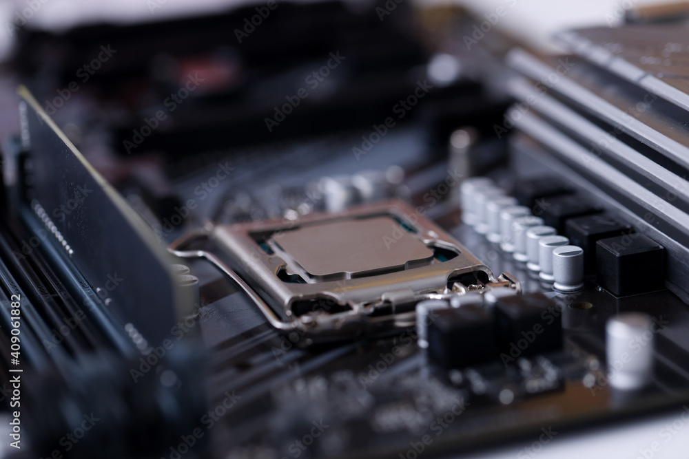 Closeup of black motherboard with installed processor Closeup of black motherboard with installed processor