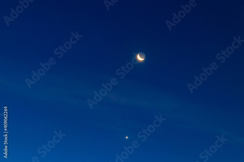 Crescent moon and stars in dark blue sky