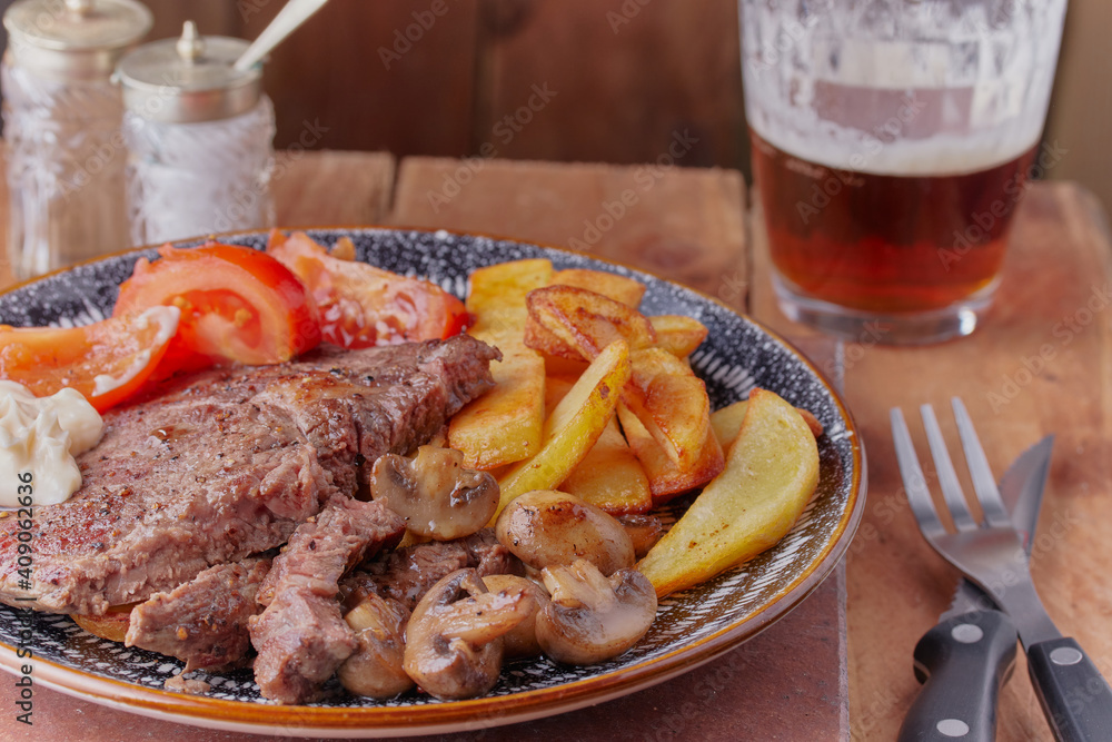 Pan fried beef steak with chips. Pan fried beef steak with chips.