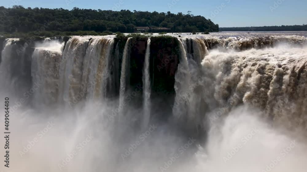 Iguazu Fa Iguazu Falls are waterfalls of the Iguazu River on the border between Argentina and Brazil. They are the largest waterfall system in the world. Iguazu Fa Iguazu Falls are waterfalls of the Iguazu River on the border between Argentina and Brazil. They are the largest waterfall system in the world.