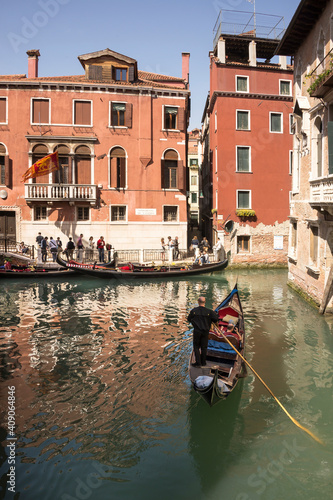  The gondolier floats on a gondola with tourists