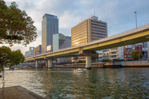 Osaka - cityscape and river O and speedboat. Spring coming - time of sakura! © Marat Lala