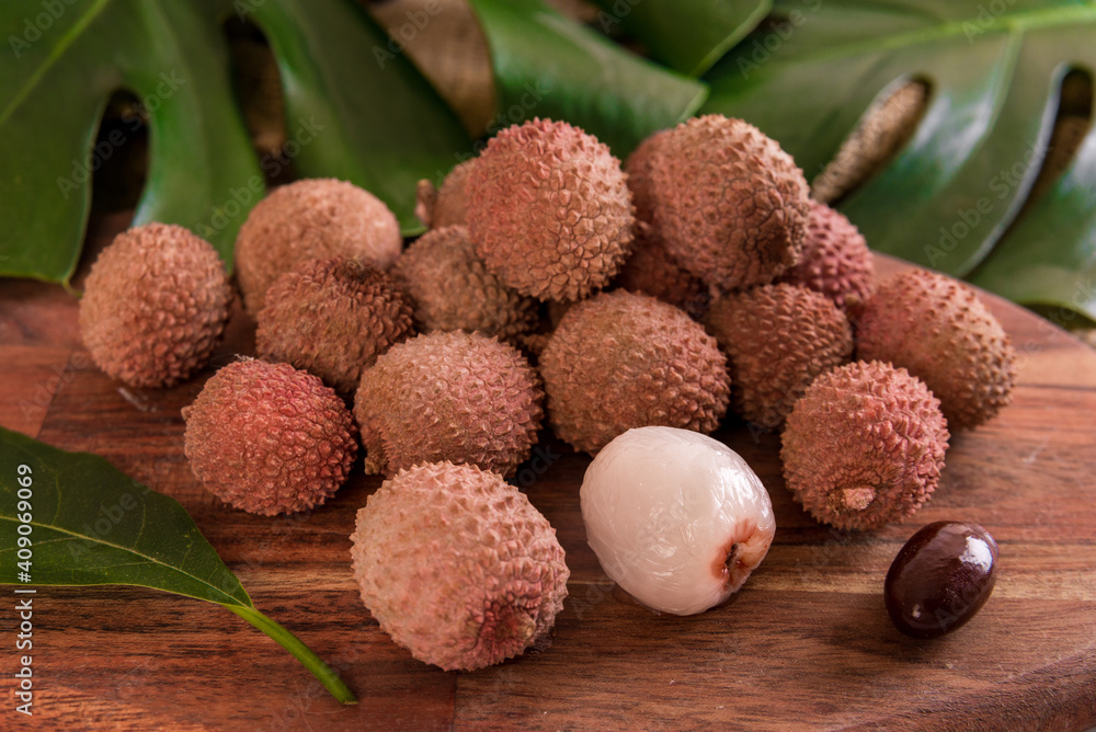 fresh organic lychee fruit on bamboo basket and old wood background, Blurred background selective focus fresh organic lychee fruit on bamboo basket and old wood background, Blurred background selective focus