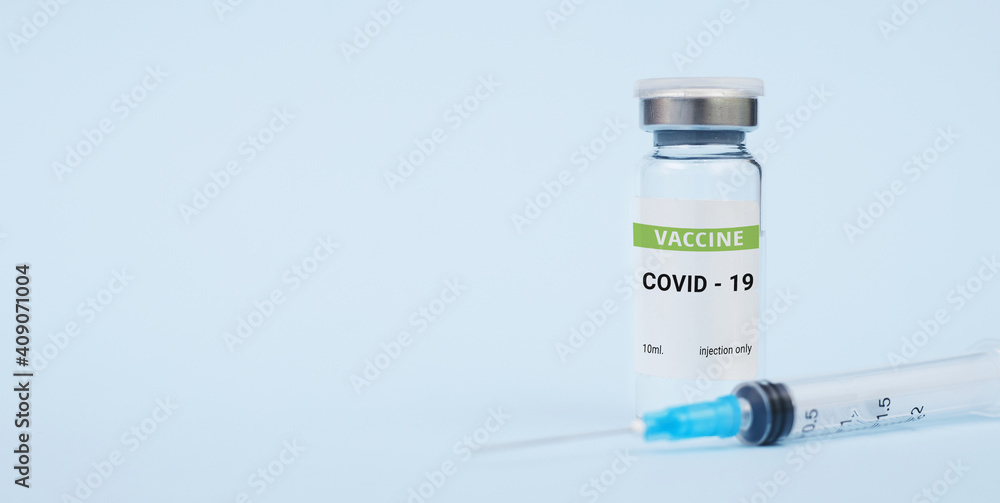 Vaccine against coronavirus, covid-19 concept. on a blue background. copy space, banner Vaccine against coronavirus, covid-19 concept. on a blue background. copy space, banner