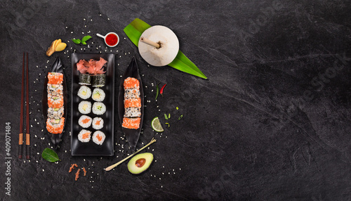 Set of sushi and maki roll on stone table. Top view
