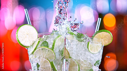 Ice cube and lime splashing...