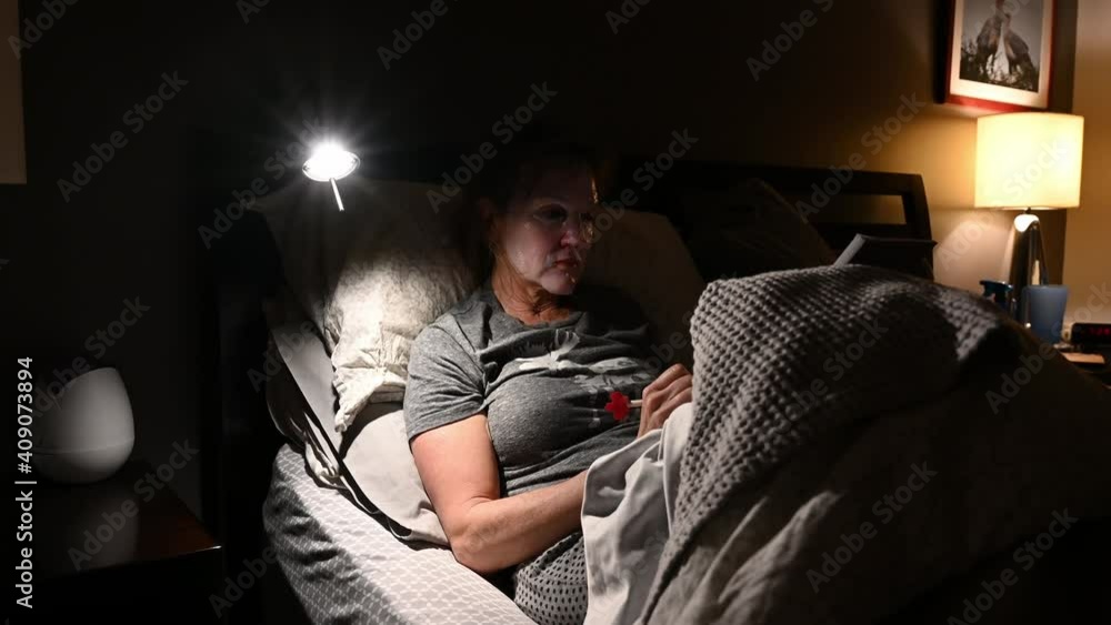 Woman with hydrating mask in bed. Woman with hydrating mask in bed.