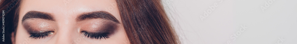 Beautiful macro shot of female eye. Closeup macro shot of fashion eyes visage. Banner size Beautiful macro shot of female eye. Closeup macro shot of fashion eyes visage. Banner size