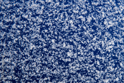 Background, texture of fresh fallen snow. Snowflakes close-up. The winter time of year