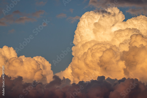 Cumulonimbus during sunset. Top of cumulus cloud. Dramatic sky before storm photo