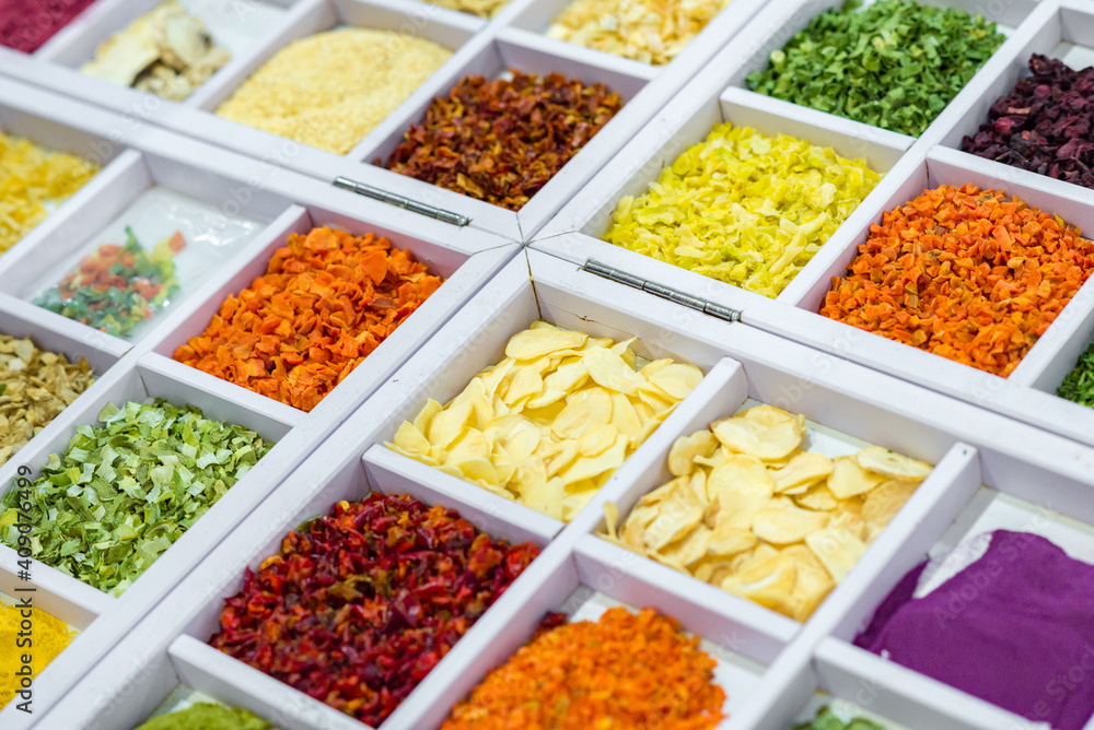 Dried vegetables in wooden box, onions, beets, carrots, pumpkin, bay leaf. Superfoods, herbs.