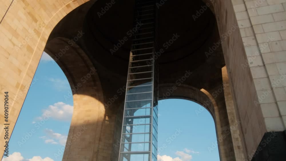 Monument to the Revolution under a bright blue sky