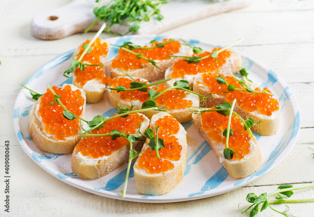 Canape with salmon red caviar. Sandwich for lunch. Delicious food. Canape with salmon red caviar. Sandwich for lunch. Delicious food.