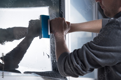 Fotografie Installation of window film in the office