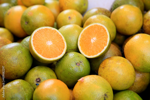 salvador, bahia, brazil - january 27, 2021: orange fruits are seen for sale at the fair in japan, in the Liberdade neighborhood in the city of Salvador.
 photo