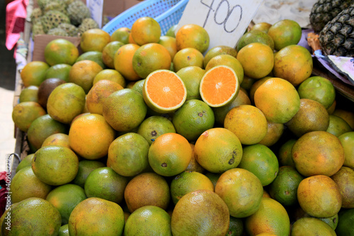 salvador, bahia, brazil - january 27, 2021: orange fruits are seen for sale at the fair in japan, in the Liberdade neighborhood in the city of Salvador.
 photo