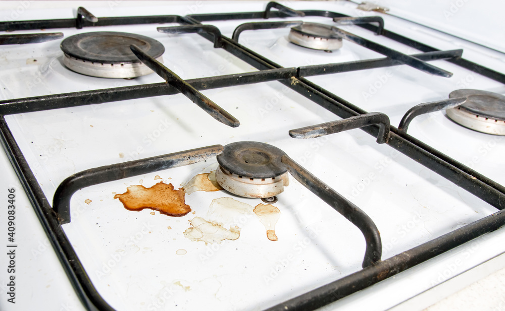 Dirty gas stove burners in kitchen room after cooking Stock Photo Adobe Stock