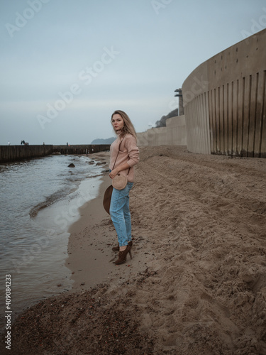 girl at sea with a handmade jute bag photo