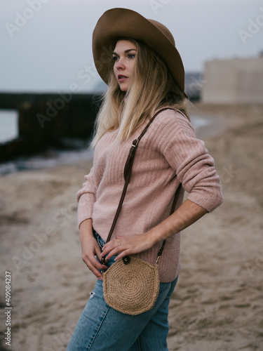 girl in Hat at sea with a handmade jute bag