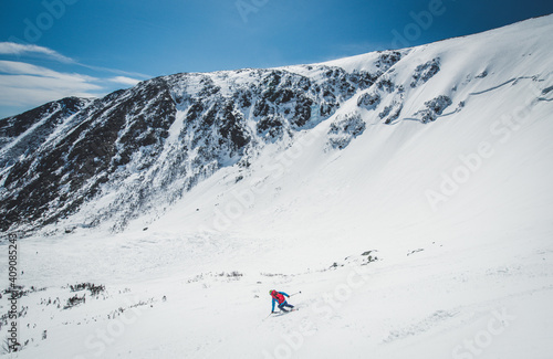 Skier descending Tuckerman Ravine, New Hampshire photo