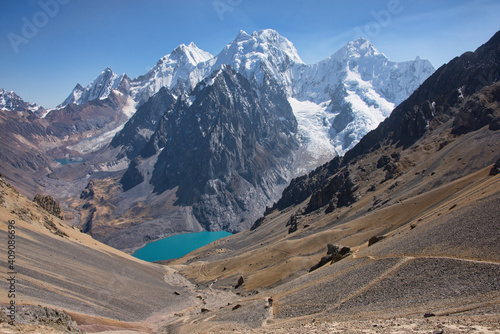 Trekker descending Santa Rosa Pass on the Cordillera Huayhuash circuit, Ancash, Peru © raquelm.