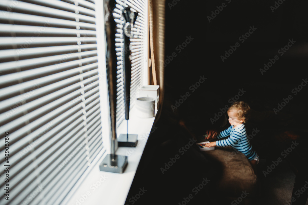 Little child playing alone during quarantine times due to covid Little child playing alone during quarantine times due to covid