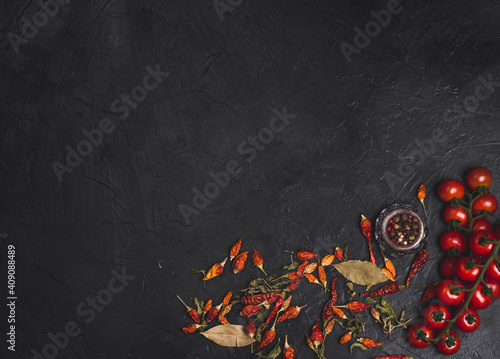 Top view of spices on dark vintage background.