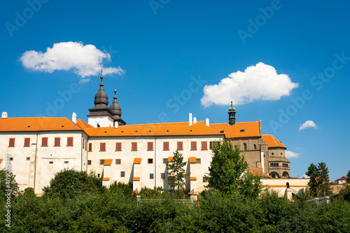 Low angle view of St. Procopius Basilica against blue sky on sunny day, UNESCO, Trebic, Trebic District, Vysocina Region, Czech Republic photo