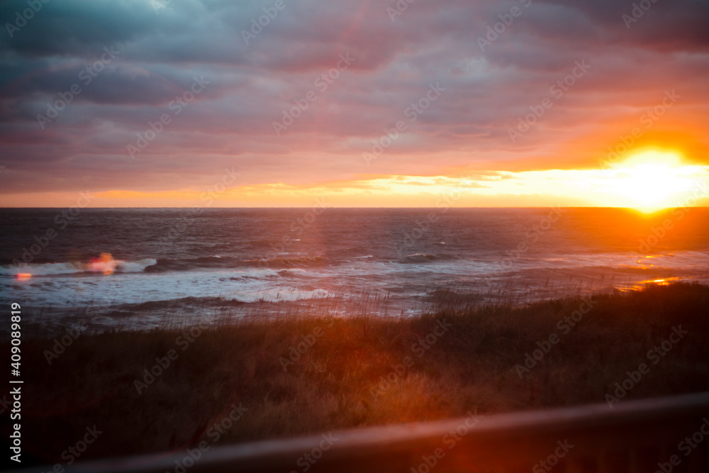 Sunrise over the ocean with cloud cover Sunrise over the ocean with cloud cover