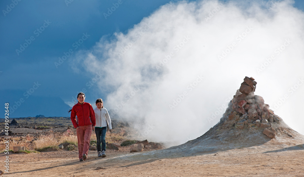 Mother and daughter exploring the geothermal hot spring area at Myvatn Mother and daughter exploring the geothermal hot spring area at Myvatn
