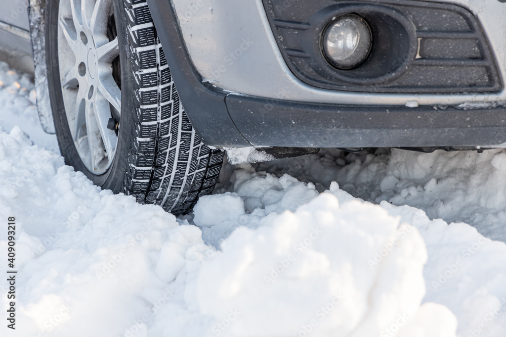 Cars is on the snowy road in winter day Cars is on the snowy road in winter day