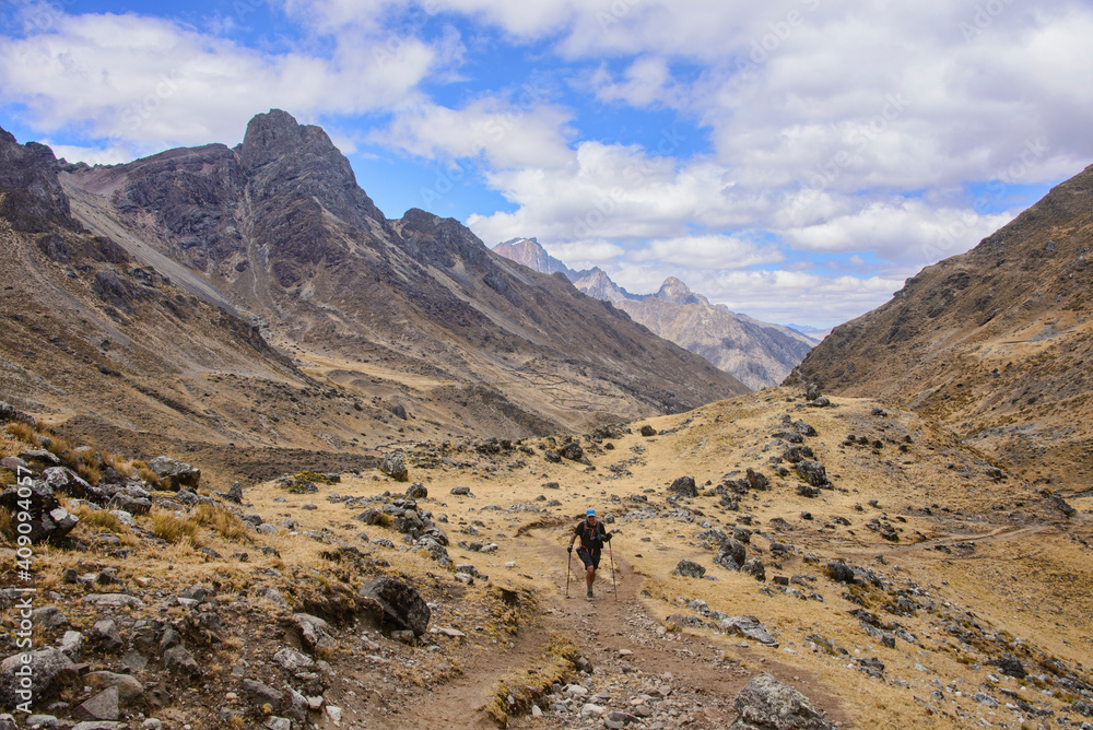Trekker heading towards Tapush Punta, Cordillera Huayhuash circuit, Ancash, Peru